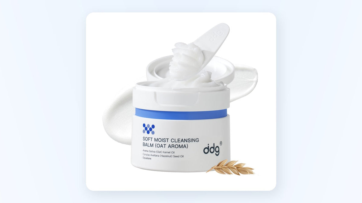 Open ddg cleansing balm jar with spatula and oat grains