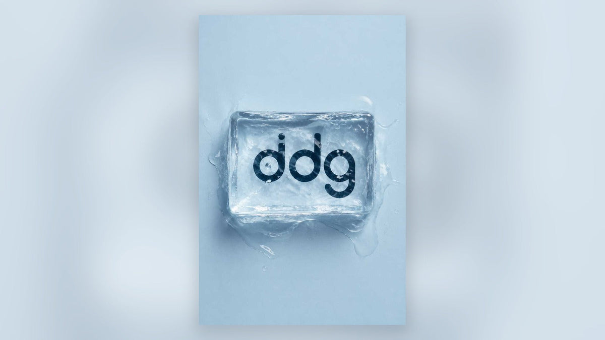 ddg logo frozen in clear ice on a pale blue background