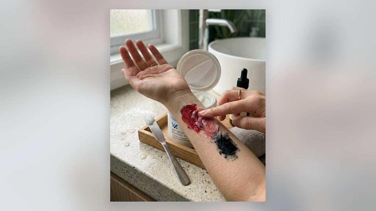 ddg cleansing balm massaged into red and black makeup swatches